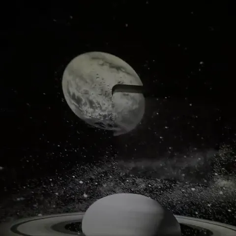 Still from the seller's video: the Moon above Saturn's rings on a dark ceiling.